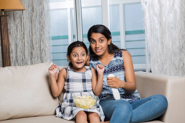 Family time - Stock image Watching, Television Set, Daughter, Watching TV, Domestic Life asian kids watching tv stock pictures, royalty-free photos & images