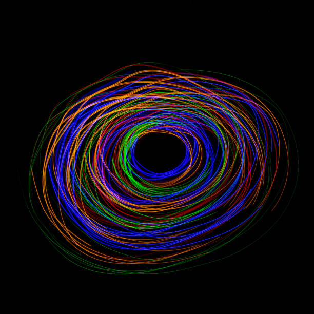 istock Light Trail Vortex - Multi Coloured, Motion Trails Light Painting on Black Background 1026186844