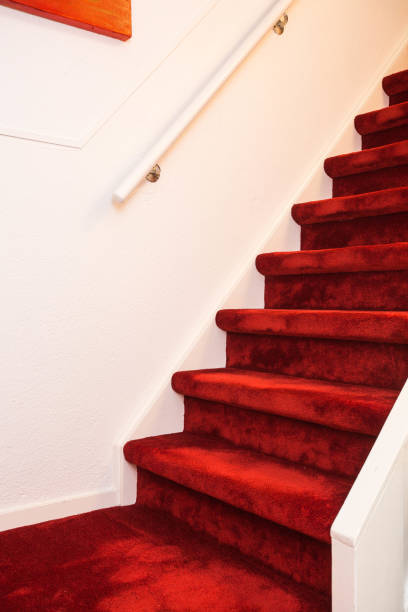 istock Modern Indoor Marble Staircase With Red Carpet. 1026191890
