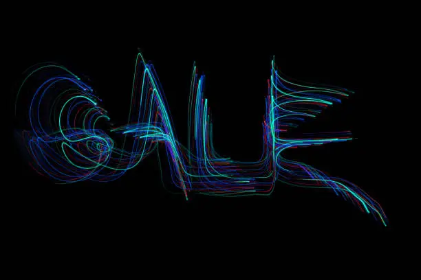 The word ‘SALE’ painted in the air in motion trails, captured on a long exposure. This text light painting on a black background consists of vibrant blue highlighted neon colours which are abstract, modern, stylish and unique. v1