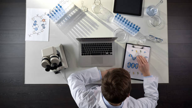 istock Medical student studying DNA image, conducting genetics research, top view 1026202652