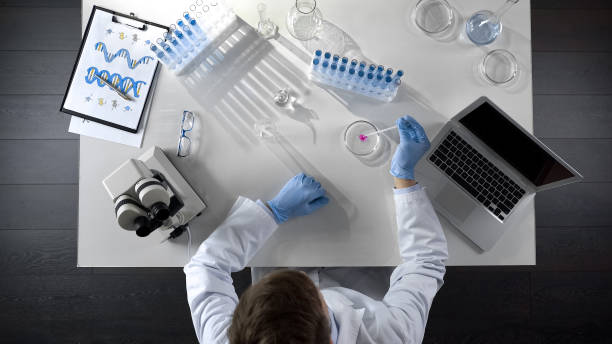 istock Lab researcher watching chemical reaction by adding reagent into special liquid 1026202788