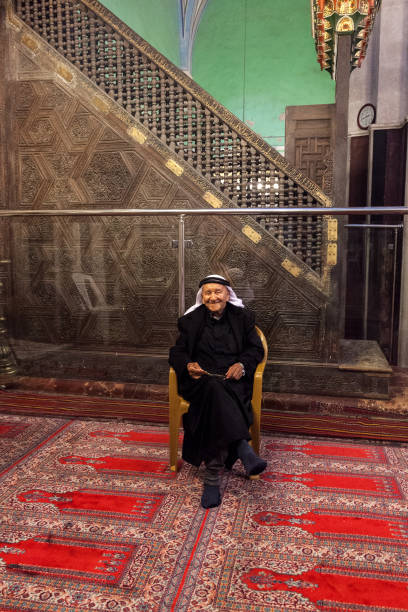 Abraham mosque in Hebron Hebron, Palestine, June 21, 2014: A Palestinian elderly man sits on a chair in the main hall in historic Abraham mosque in Hebron. father abraham stock pictures, royalty-free photos & images