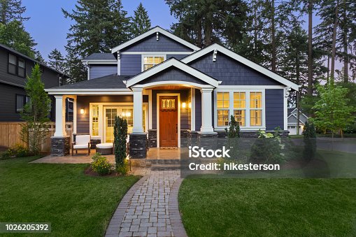 istock Beautiful luxury home exterior at twilight 1026205392