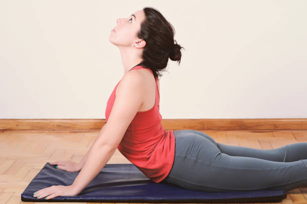 istock Close up view of woman doing exercise indoors 1026218398
