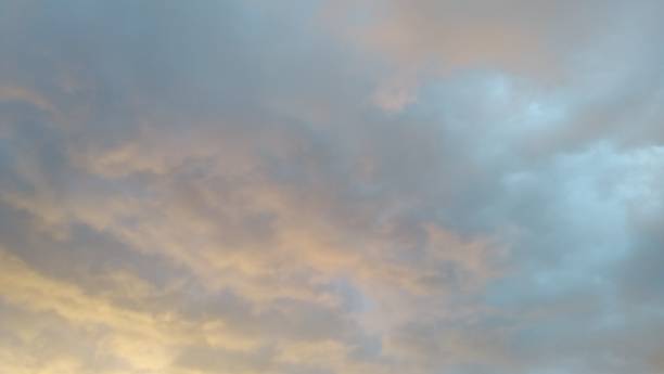 istock Thunderstorm cloud sky gray orange and blue 1026221304