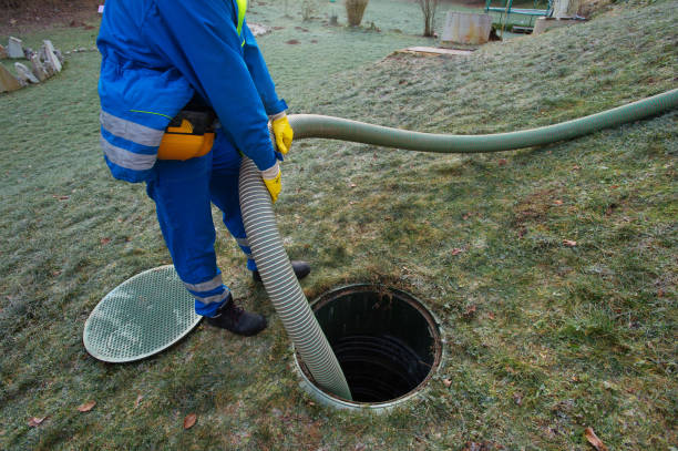 Cleaning septic tank Emptying household septic tank. Cleaning sludge from septic system. sewage photos stock pictures, royalty-free photos & images