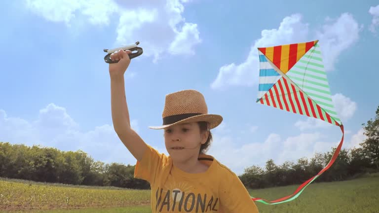 Beautiful Little Girl Flying A Kite. Happy Memories Of Her Young Days