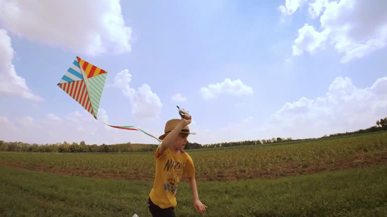 Beautiful Little Girl Flying A Kite. Happy Memories Of Her Young Days