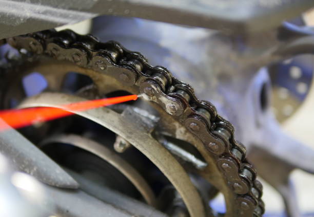 istock closeup  lubricating motorcycle chain with oil spray 1026242028