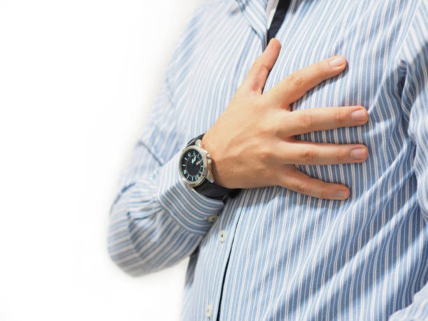 istock man holding his heart with his hand 1026252788