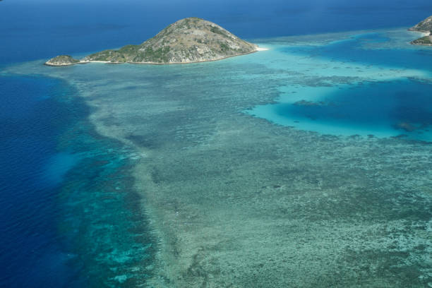 Aerial view around Lizard Island, Great Barrier Reef Aerial view of the lagoon, coral reefs and small islands adjacent to Lizard Island, Great Barrier Reef, Queensland, Australia. lizard island stock pictures, royalty-free photos & images