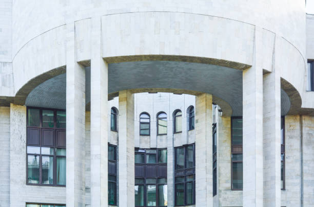 istock Urban city modern building with semicircular ledge with columns. Old town house 1026257774