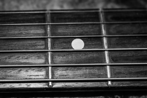 istock Electric guitar fretboard and strings upclose 1026268000