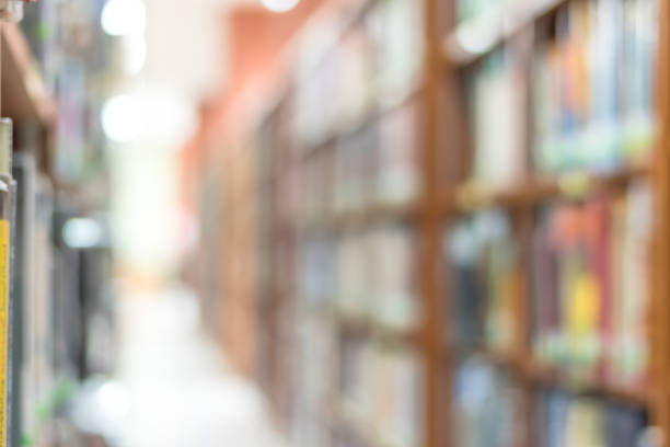 istock Blur school library or study room with book shelves for education background 1026273090