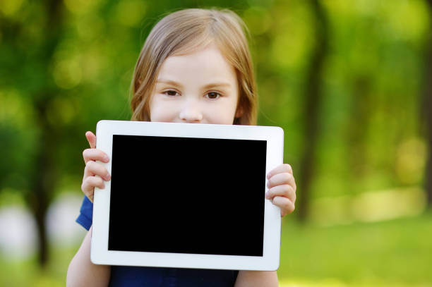 Asian woman holding a tablet