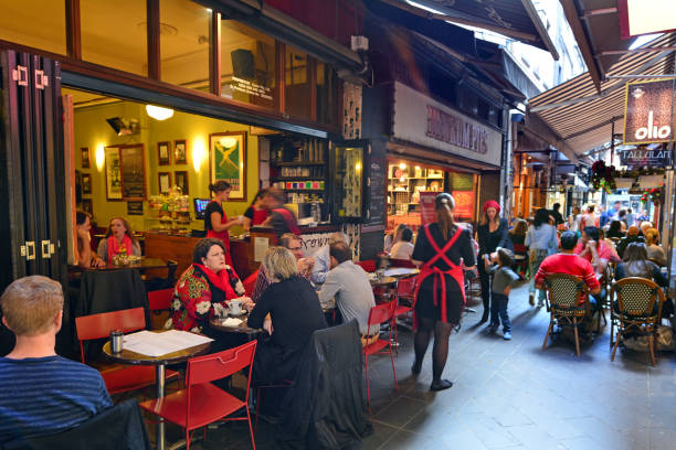 MELBOURNE, AUSTRALIA  - APR 13 2014: Diners eat and drink at a Melbourne cafe and restaurant and on Hardware Lane in Melbourne Victoria, Australia.