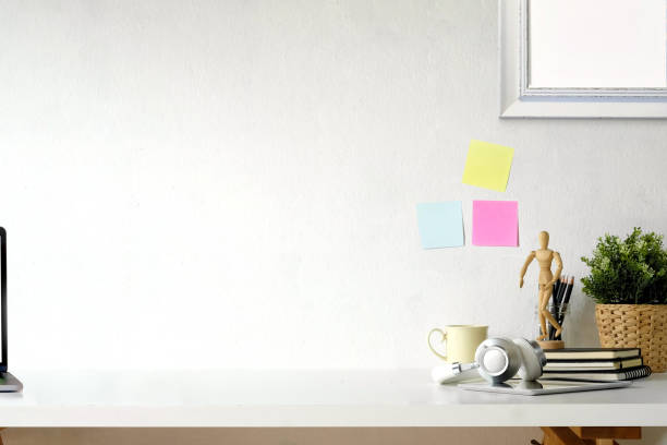Loft workspace with hipster office supplies. white desk and copy space