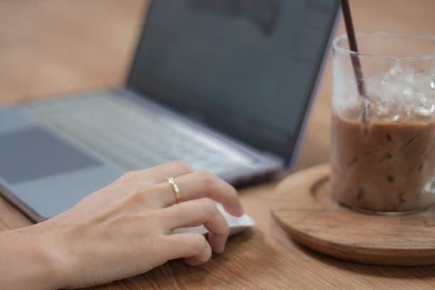 istock Woman working on computer in coffee shop 1026290736