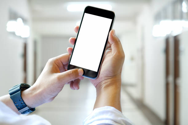istock Close up of a man using blank screen mobile smart phone 1026290758