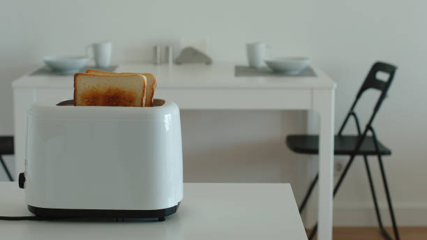 istock Fried toast in a toaster in a kitchen 1026290782