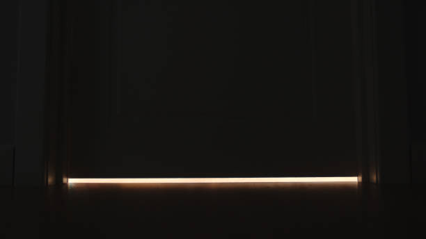 Light under a door at home in the night