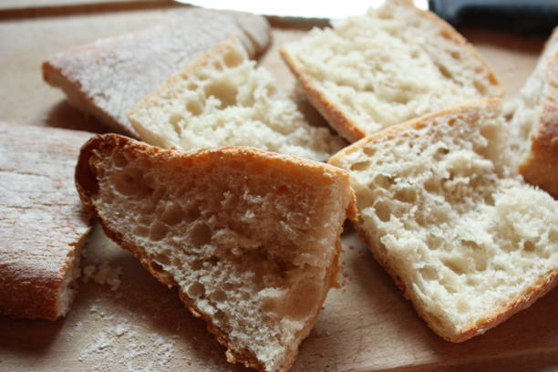 istock Toasted bread toasts  Cutting board  Bread knife 1026291104