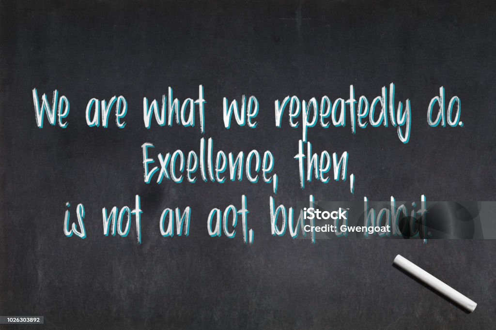 Quote from Aristotle about excellence Blackboard with a quote from Aristotle drawn in the middle saying "We are what we repeatedly do. Excellence, then, is not an act, but a habit.". Aristotle Stock Photo