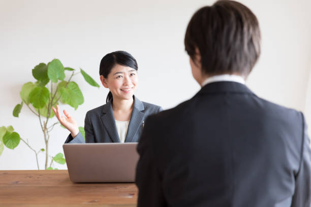 istock asian business person talking in office 1026308790