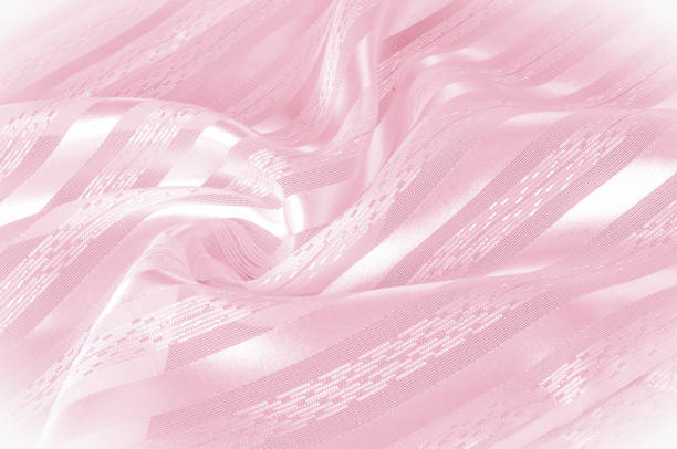 istock Background texture, pattern. Pink silk fabric with a light stripe. A smooth elegant pink silk or satin texture can be used as a background. Trend of color rose quartz pink pastel tone 1026335526