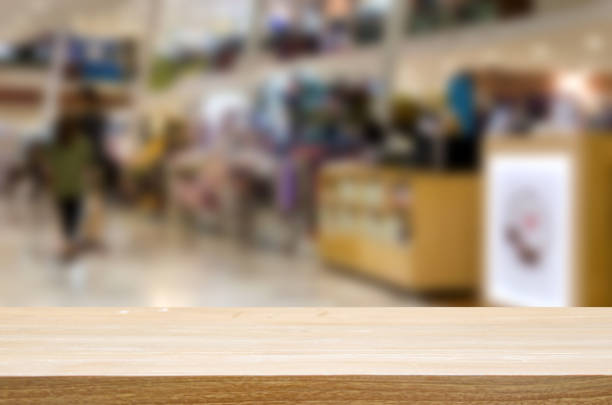 istock Wood table top blurred shopping mall 1026344480