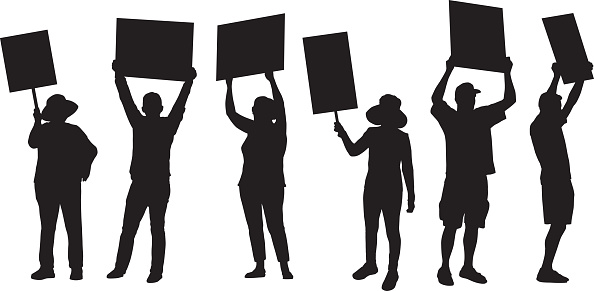 Vector silhouette of six standing people holding up protest signs.