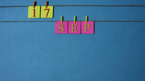 istock September, copy space with rope colored papers calendar 1026393502