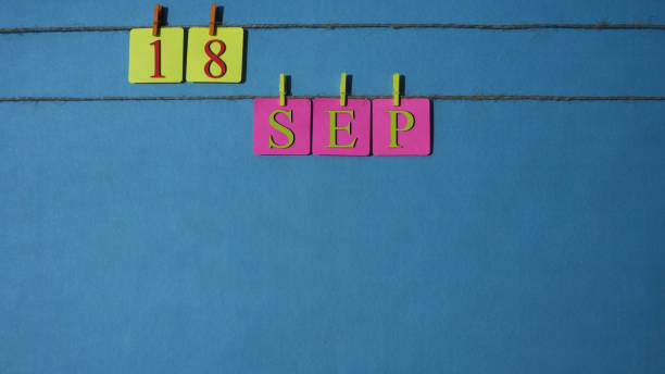 istock September, copy space with rope colored papers calendar 1026393504
