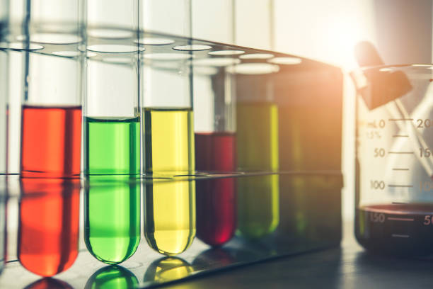 istock Laboratory glassware containing colorful chemical liquid, lab research and development concept 1026397090