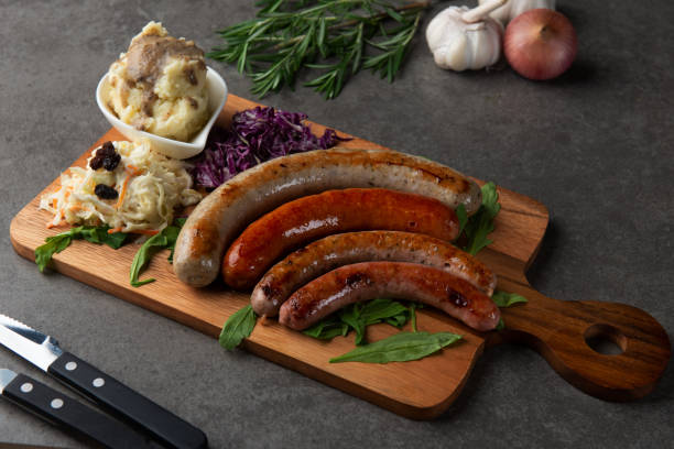 istock Grilled sausages on wooden board 1026399378