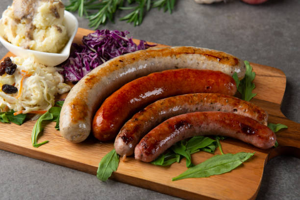 istock Grilled sausages on wooden board 1026399420