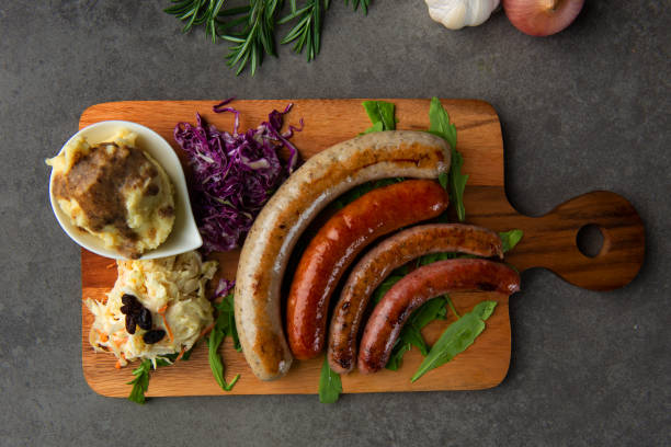 istock Grilled sausages on wooden board 1026399440