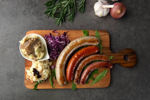 istock Grilled sausages on wooden board 1026399450