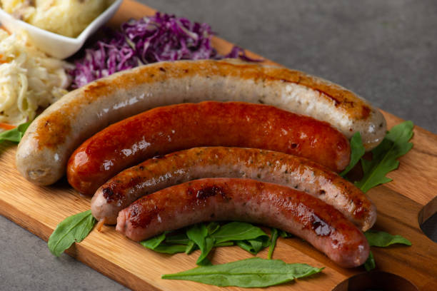 istock Grilled sausages on wooden board 1026399486