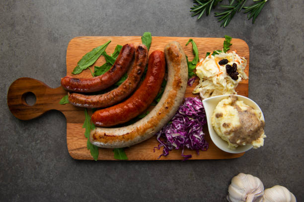 istock Grilled sausages on wooden board 1026399488