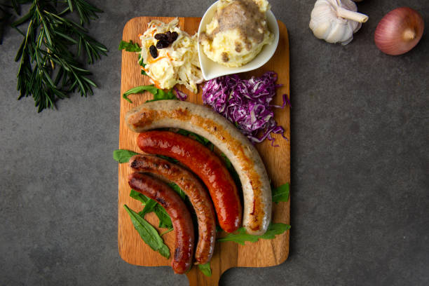 istock Grilled sausages on wooden board 1026399492