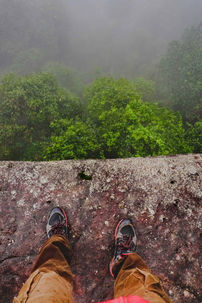 istock leg of men standing on cliff 1026403794