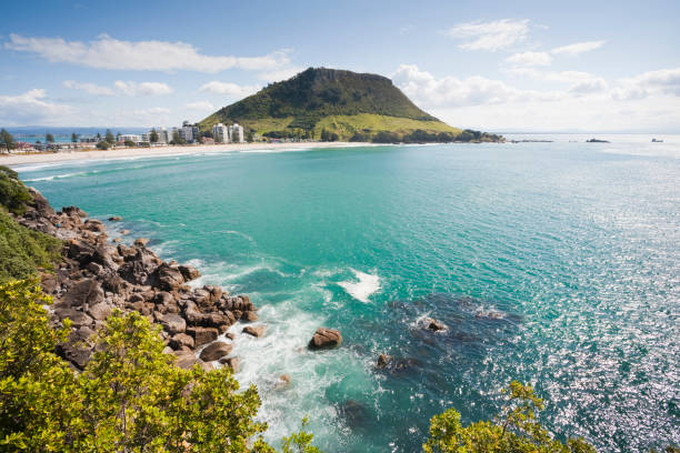 Mount Maunganui, Bay of Plenty, New Zealand, View of Mount Maunganui, Bay of Plenty, New Zealand, from Moturiki Island. The Mount, also known as Mauao, is an extinct volcano. mount maunganui stock pictures, royalty-free photos & images