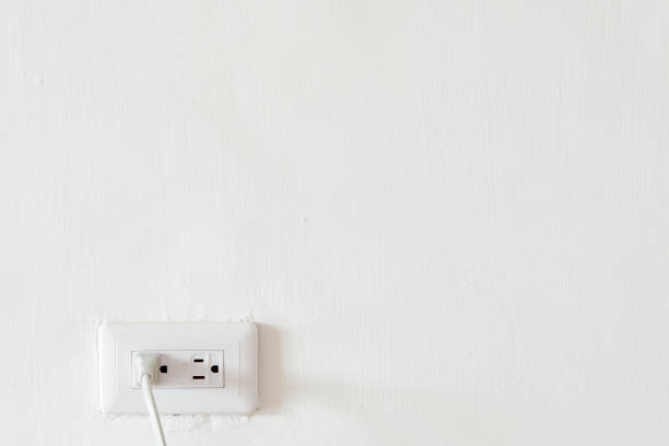 istock Electric plug outlet isolated on white background. 1026414990