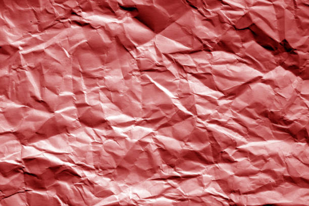 amassado folha de papel em tom vermelho. - 11911 - fotografias e filmes do acervo