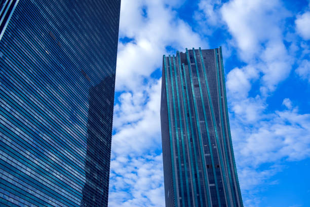istock Modern Building Architecture with blue sky and clouds 1026423884