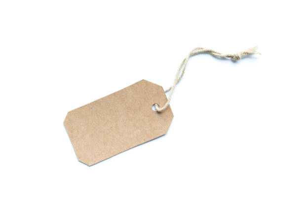 istock Blank brown cardboard price tag or label with thread isolated white background. 1026431654