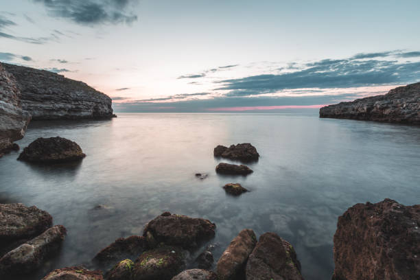 istock Brilliant vacation destination beach sunrise and sea cliffs background 1026434102