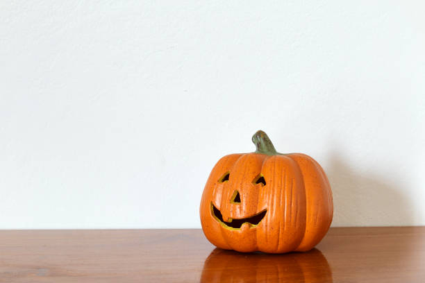 istock Halloween Pumpkin miniature decoration isolated on white background. 1026434692